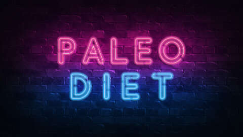 Paleo: Neonschild mit Aufschrift Paleo Diet auf einer Ziegelsteinwand